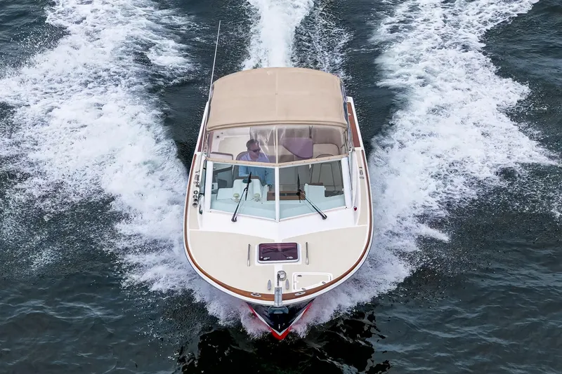 Slide: The Image of 2006 Hunt Yachts Harrier 25 cruising on open water, top view. - 11