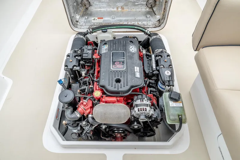 Slide: The Image of Engine compartment of 2006 Hunt Yachts Harrier 25, showcasing detailed mechanical components. - 37