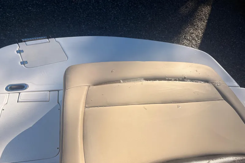 Slide: The Image of 2015 Hurricane SunDeck Sport 188 IO boat seat with visible wear and tear. - 12