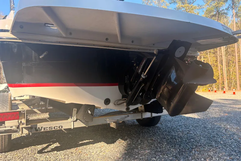 Slide: The Image of 2015 Hurricane SunDeck Sport 188 IO boat on trailer, rear view with propeller. - 14