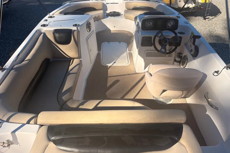 Slide: The Image of 2015 Hurricane SunDeck Sport 188 IO boat interior with seating and steering console. - 6