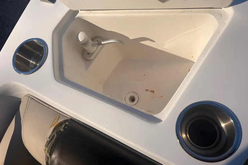 Slide: The Image of 2015 Hurricane SunDeck Sport 188 IO boat sink with cup holders and worn seat. - 8
