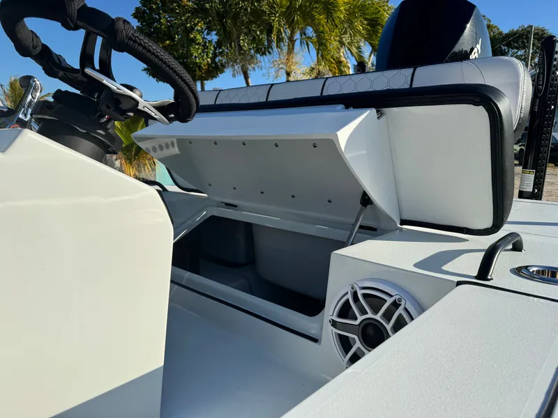 Slide: The Image of Vtech 18 FLATS 2026 boat with open storage compartment and speaker. - 11