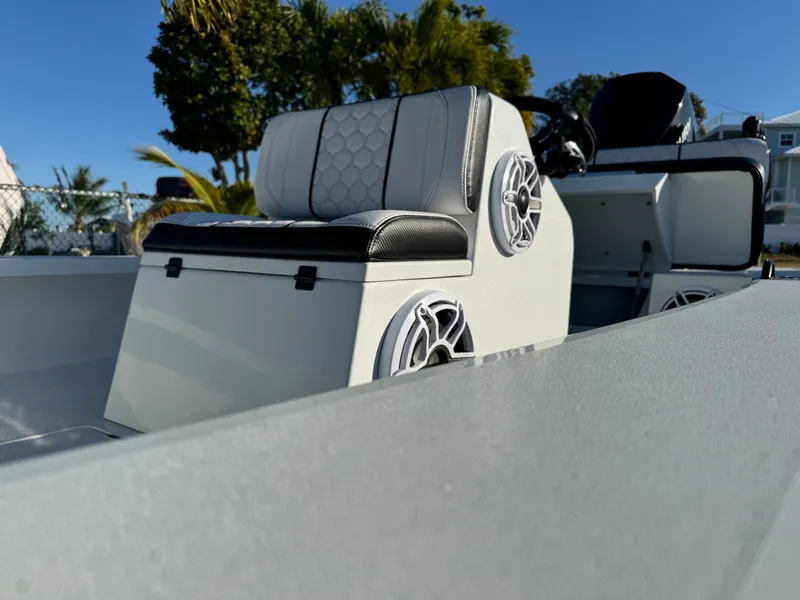 Slide: The Image of Vtech 18 FLATS 2026 boat with modern seating and speakers. - 15