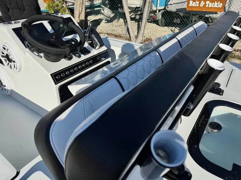 Slide: The Image of Vtech 18 FLATS boat console with steering wheel and rod holders, 2026 model. - 23