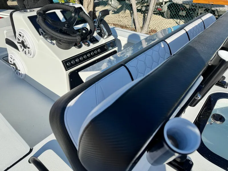 Slide: The Image of Vtech 18 FLATS 2026 boat console with steering wheel and speakers. - 24