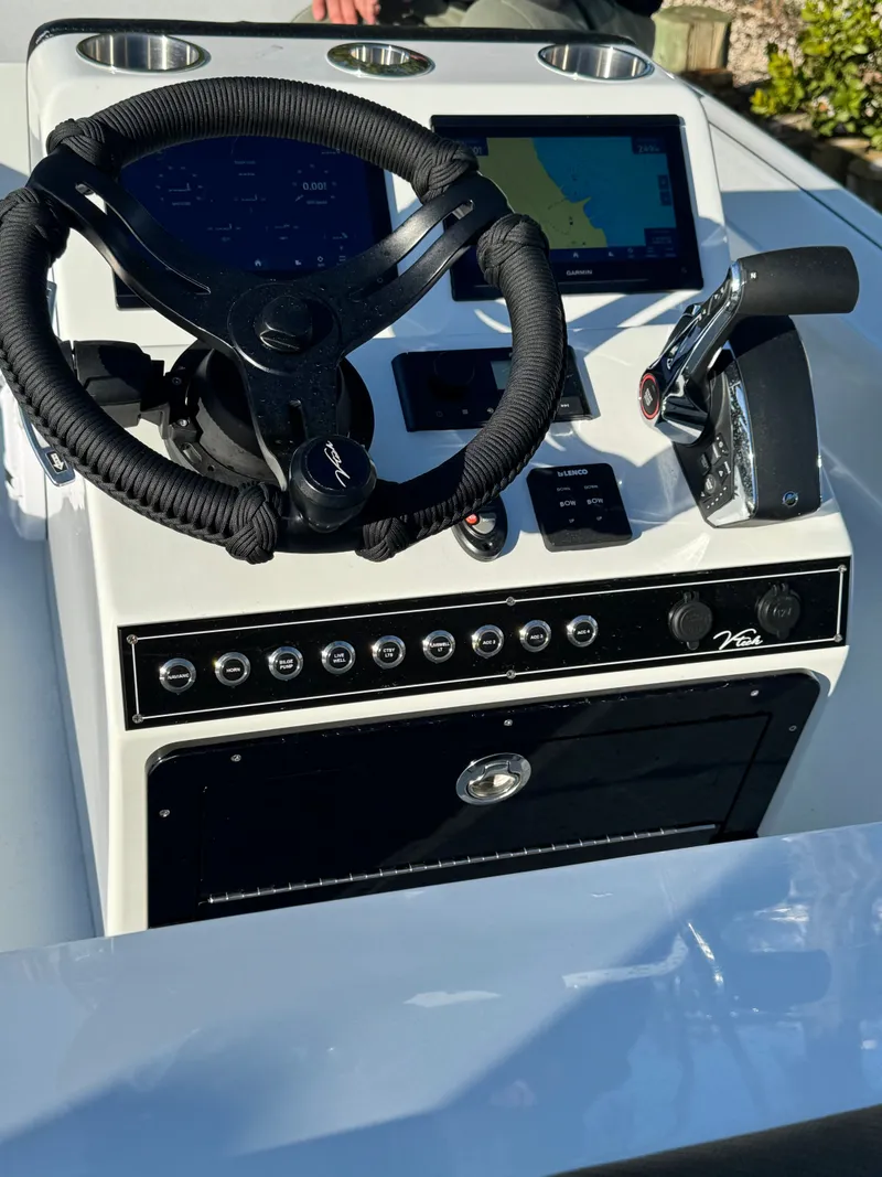 Slide: The Image of Vtech 18 FLATS 2026 boat console with steering wheel and navigation system. - 25