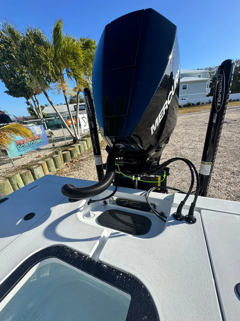 Slide: The Image of Vtech 18 FLATS boat with Mercury engine, 2026 model, on a sunny dock. - 28