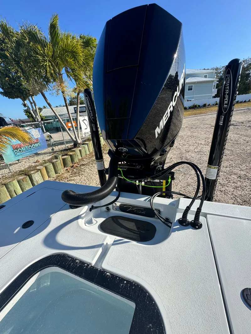 Slide: The Image of Vtech 18 FLATS 2026 boat with Mercury engine outdoors. - 29