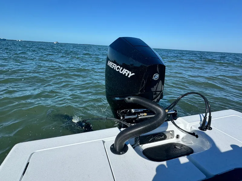 Slide: The Image of Vtech 18 FLATS boat with Mercury outboard motor on water. - 31