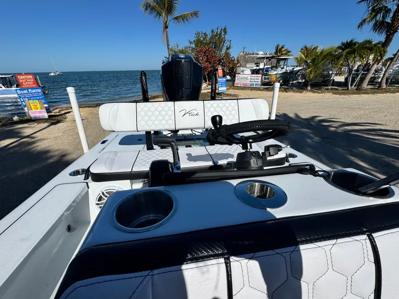 Slide: The Image of Vtech 18 FLATS boat at beach with palm trees, 2026 model. - 36