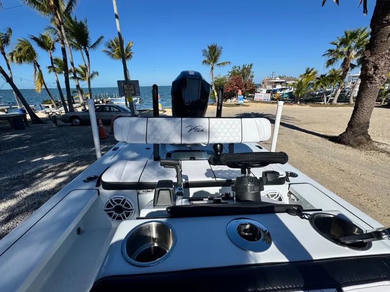 Slide: The Image of Vtech 18 FLATS boat 2026 at beach with palm trees. - 37