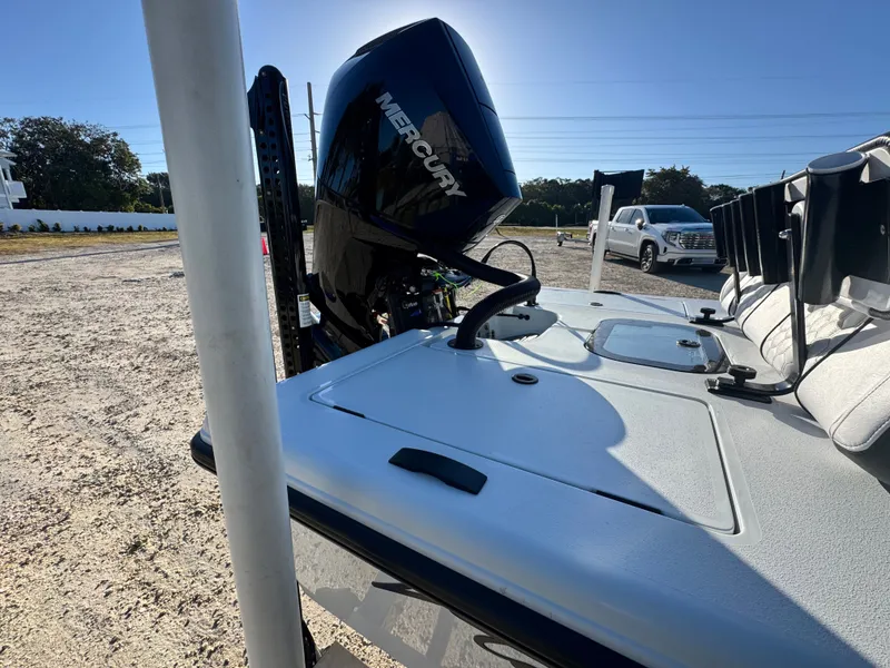 Slide: The Image of Vtech 18 FLATS 2026 boat with Mercury engine on parking lot. - 6