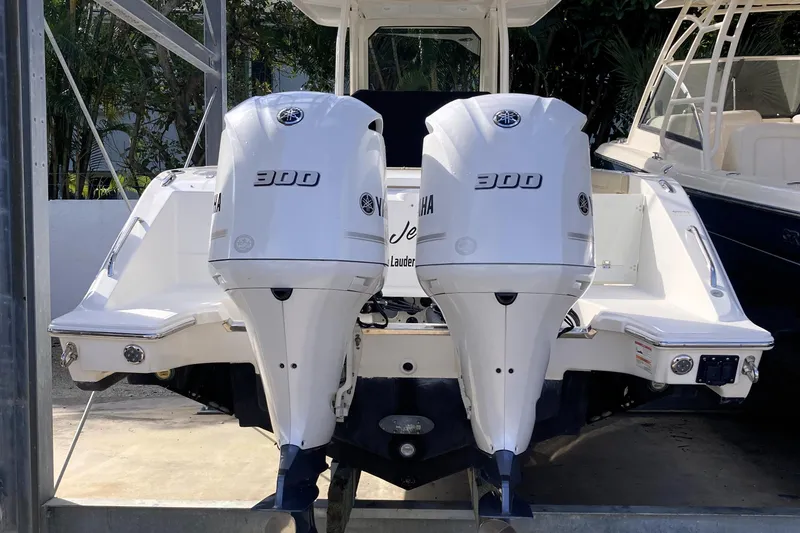 Slide: The Image of 2019 Pursuit S 288 Sport boat with dual Yamaha 300 engines, docked. - 18