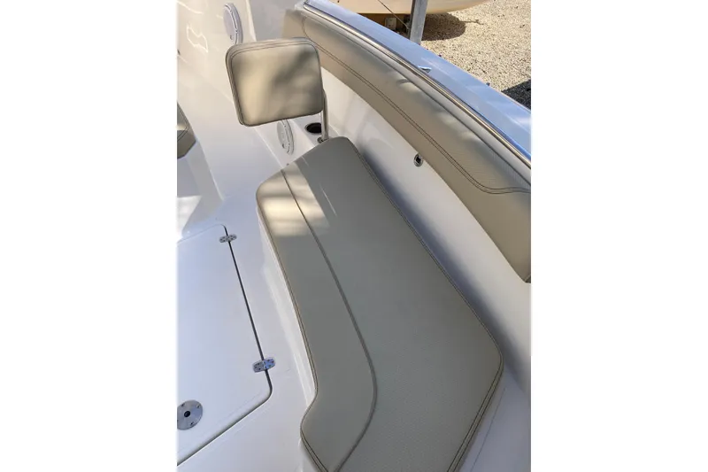 Slide: The Image of 2019 Pursuit S 288 Sport boat interior seating with beige upholstery. - 21