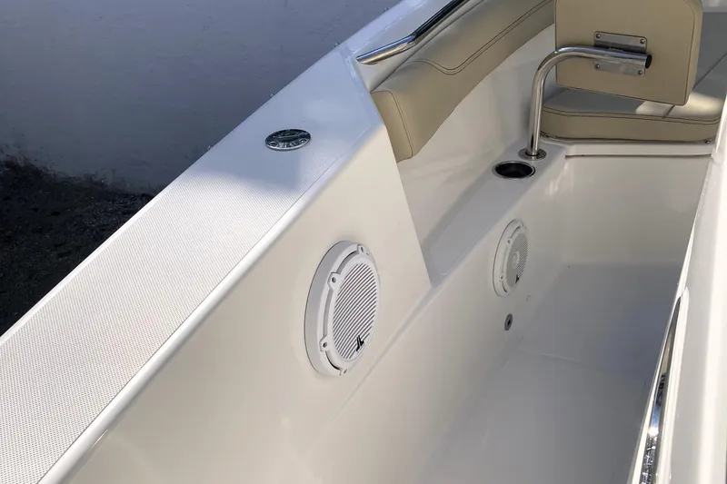 Slide: The Image of Interior view of 2019 Pursuit S 288 Sport boat, featuring seating and speakers. - 29