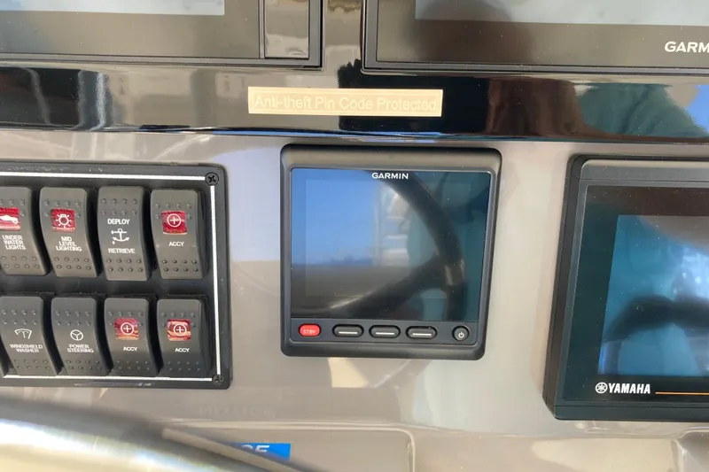 Slide: The Image of Control panel of 2019 Pursuit S 288 Sport boat with Garmin and Yamaha displays. - 36
