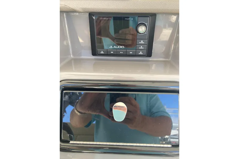 Slide: The Image of 2019 Pursuit S 288 Sport dashboard featuring JL Audio system. - 39