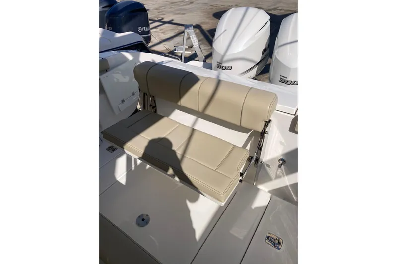 Slide: The Image of 2019 Pursuit S 288 Sport boat with beige seating and Yamaha engines. - 51