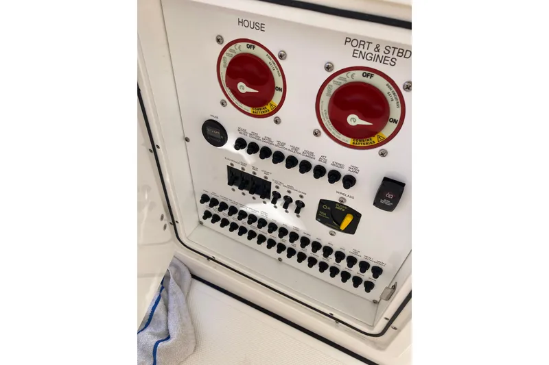 Slide: The Image of Control panel of 2019 Pursuit S 288 Sport boat with switches and dials. - 54