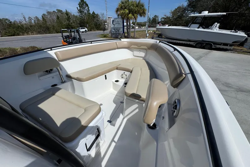 Slide: The Image of 2019 Sailfish 270 CC boat interior with beige seating and spacious layout. - 15