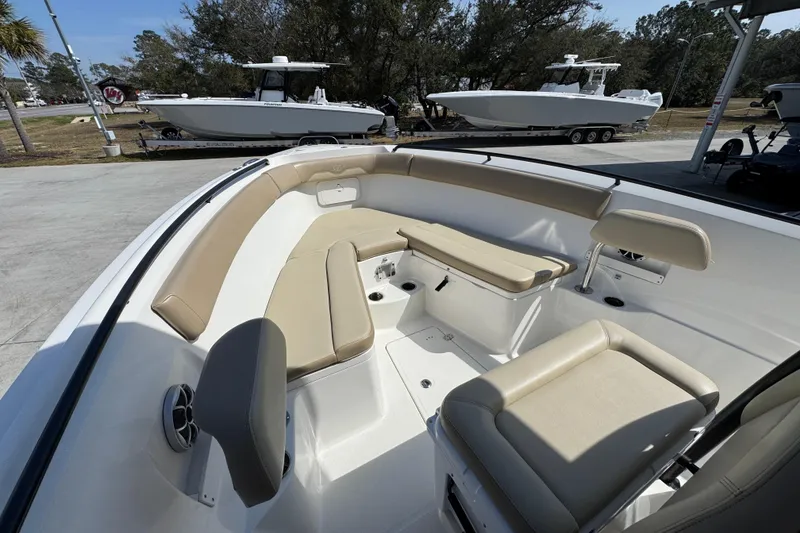 Slide: The Image of 2019 Sailfish 270 CC boat interior with beige seating and spacious layout. - 17