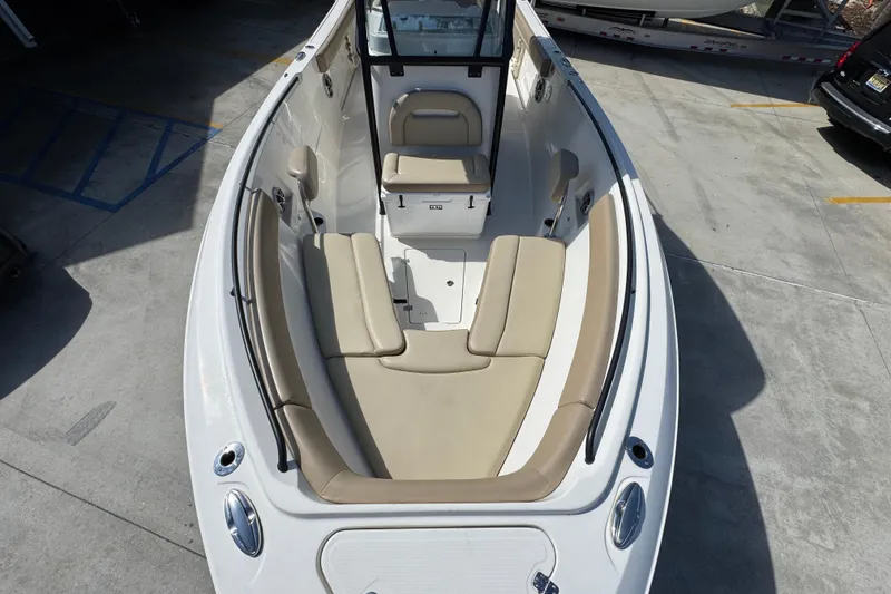 Slide: The Image of 2019 Sailfish 270 CC boat with beige seating, viewed from above in a parking area. - 18