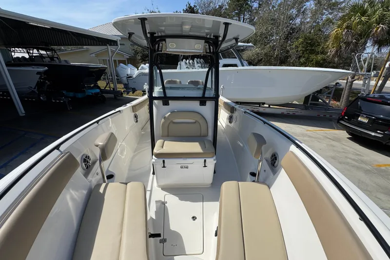 Slide: The Image of 2019 Sailfish 270 CC boat interior with beige seating and modern design. - 20