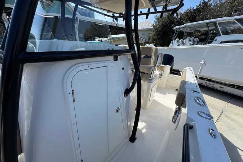Slide: The Image of 2019 Sailfish 270 CC boat interior with seating and storage compartments. - 21