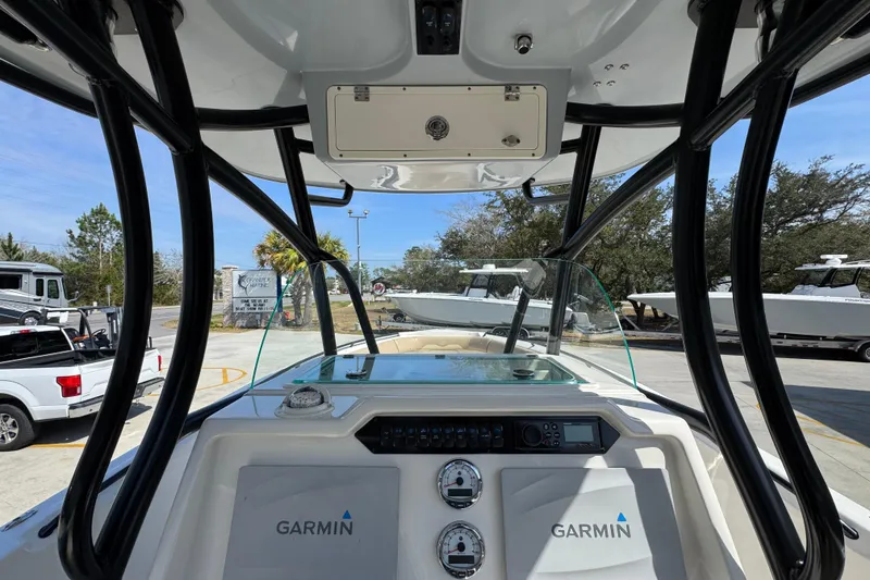 Slide: The Image of 2019 Sailfish 270 CC boat dashboard with Garmin electronics, outdoor setting. - 29