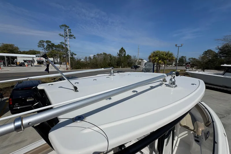 Slide: The Image of 2019 Sailfish 270 CC boat rooftop view with clear sky and trees in the background. - 36