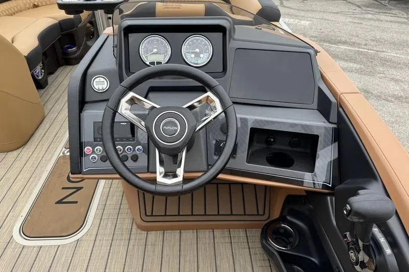 Slide: The Image of 2025 Avalon 2585 25 Catalina ENT boat dashboard with steering wheel and controls. - 6