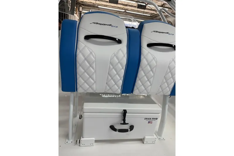 Slide: The Image of 2023 Renegade 32' Cuddy boat seats with blue and white diamond pattern upholstery. - 7