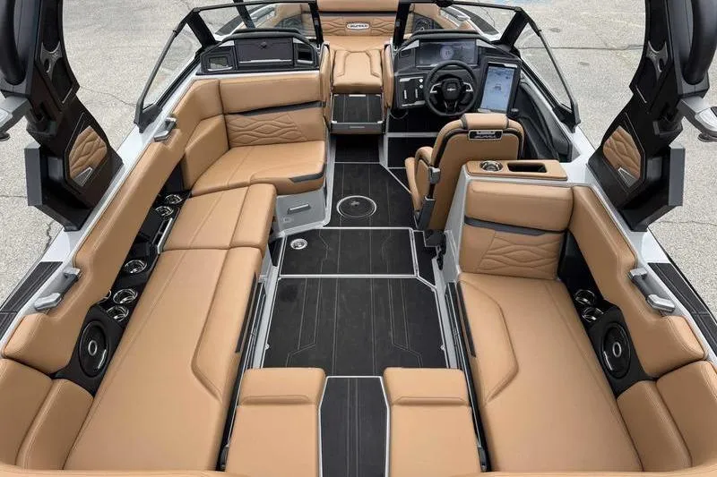 Slide: The Image of Luxurious 2026 Supra SA boat interior with tan leather seating and modern dashboard. - 10