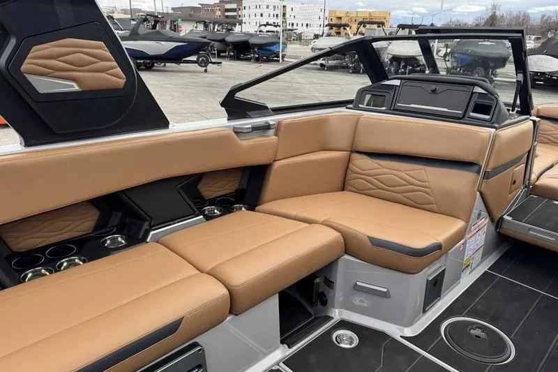 Slide: The Image of 2026 Supra SA boat interior with tan leather seating and modern design. - 11
