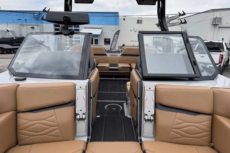 Slide: The Image of 2026 Supra SA boat interior with tan leather seats and modern design. - 12