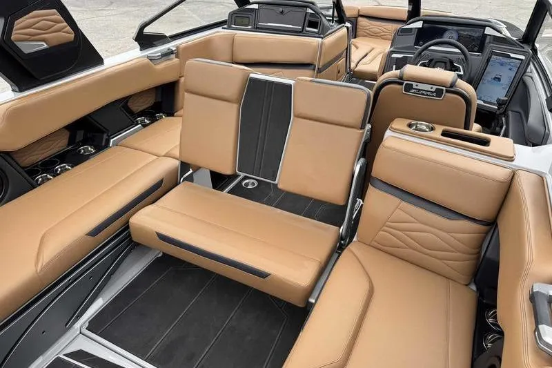 Slide: The Image of 2026 Supra SA boat interior with luxurious tan leather seating and modern dashboard. - 14