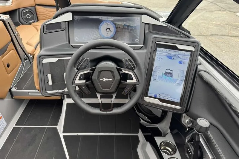 Slide: The Image of 2026 Supra SA boat dashboard with advanced digital displays and modern steering wheel design. - 16