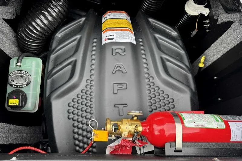 Slide: The Image of 2026 Supra SA engine compartment with fire extinguisher and emission control system. - 17