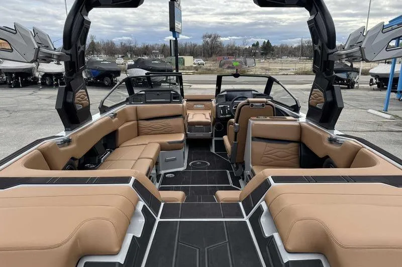 Slide: The Image of 2026 Supra SA boat interior with luxurious tan seating and modern design. - 7