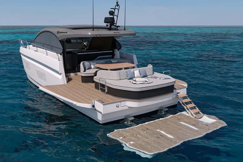 The Image of Manufacturer Provided Image: 2025 Beneteau Gran Turismo 50 yacht on open water, featuring luxurious deck and seating area. - 0