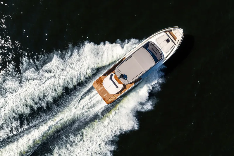 Slide: The Image of Aerial view of 2026 Beneteau Gran Turismo 50 yacht cruising on water. - 16