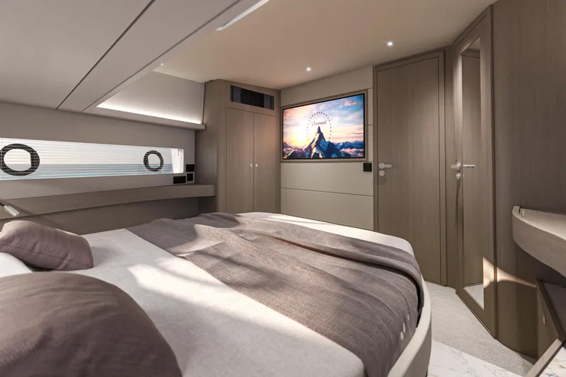 Slide: The Image of Luxurious bedroom interior of 2026 Beneteau Gran Turismo 50 yacht with modern design and large TV. - 6