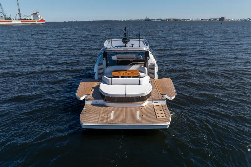 Slide: The Image of 2026 Beneteau Gran Turismo 50 yacht on open water, rear view. - 11