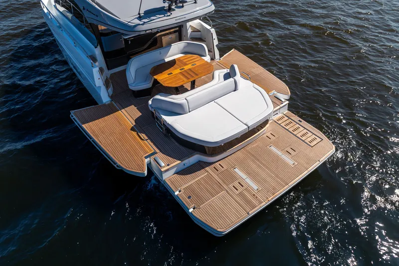 Slide: The Image of 2026 Beneteau Gran Turismo 50 yacht with spacious deck and elegant seating area. - 12