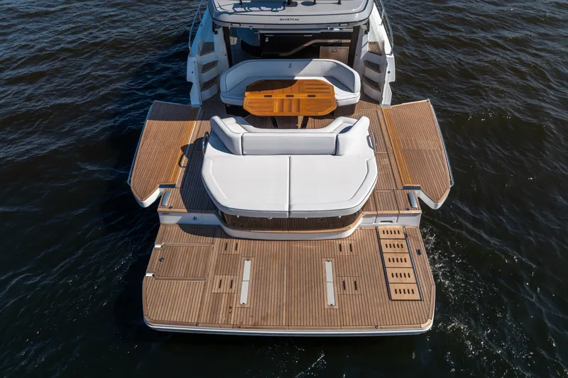 Slide: The Image of 2026 Beneteau Gran Turismo 50 yacht with spacious teak deck and elegant seating area. - 13