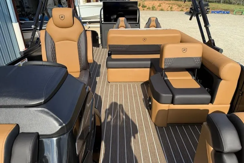 Slide: The Image of Luxurious interior of 2026 Premier 250 Solaris RF-CL boat with tan and black seating. - 17