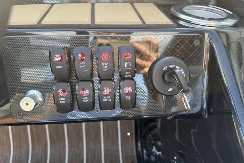 Slide: The Image of Control panel of 2026 Premier 250 Solaris RF -CL boat with switches and ignition. - 20