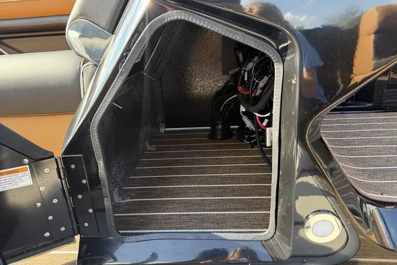Slide: The Image of Open storage compartment in 2026 Premier 250 Solaris RF -CL boat, showing interior wiring. - 18