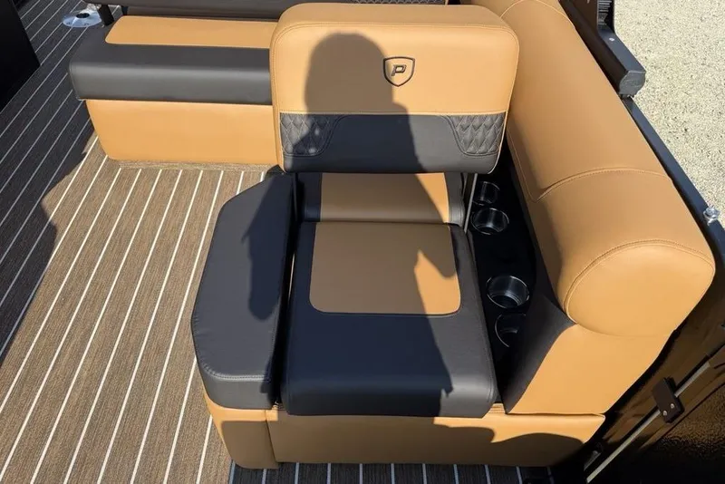 Slide: The Image of Luxurious seating on 2026 Premier 250 Solaris RF-CL boat with tan and black upholstery. - 23